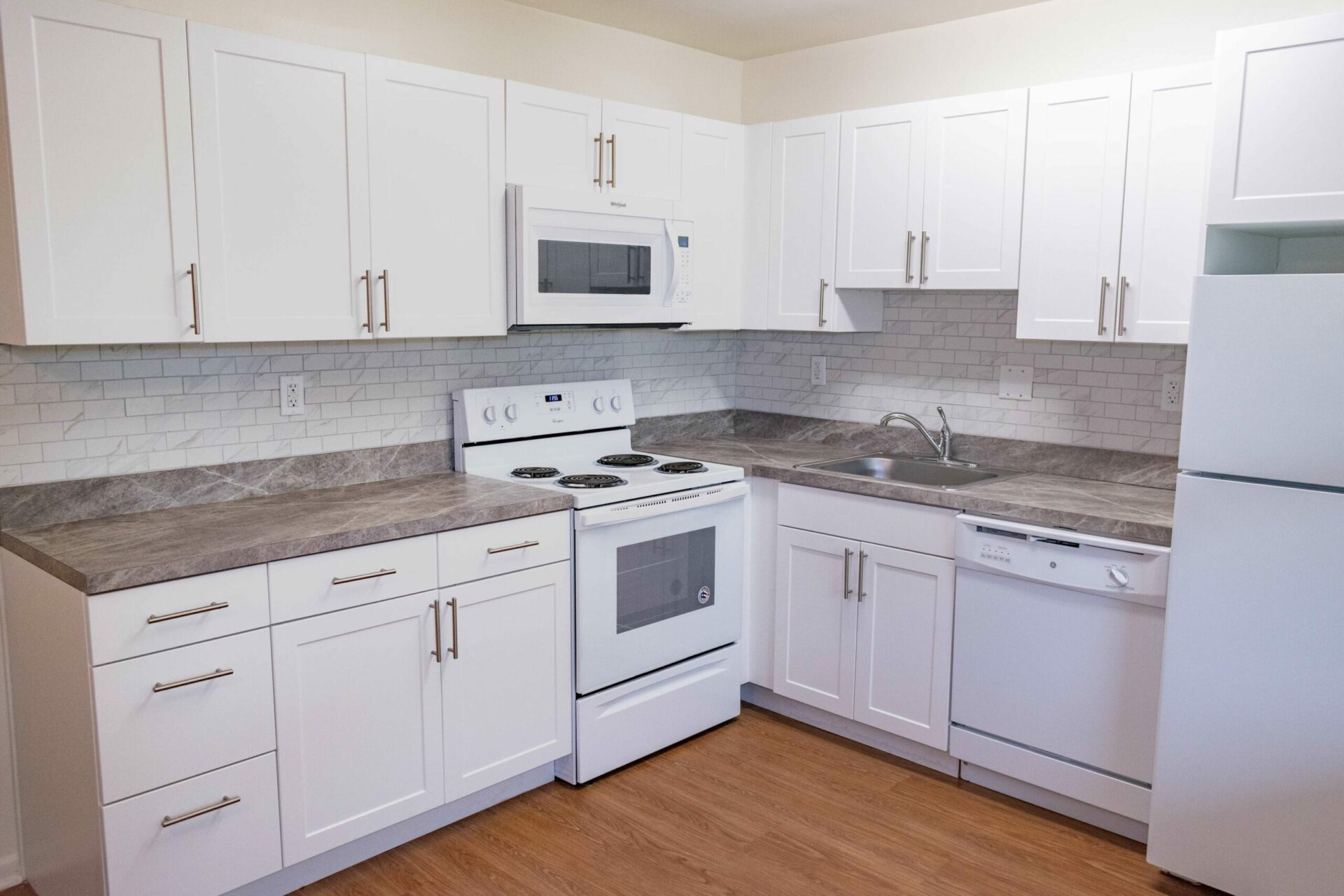 Westover Village kitchen with white cabinets and appliances