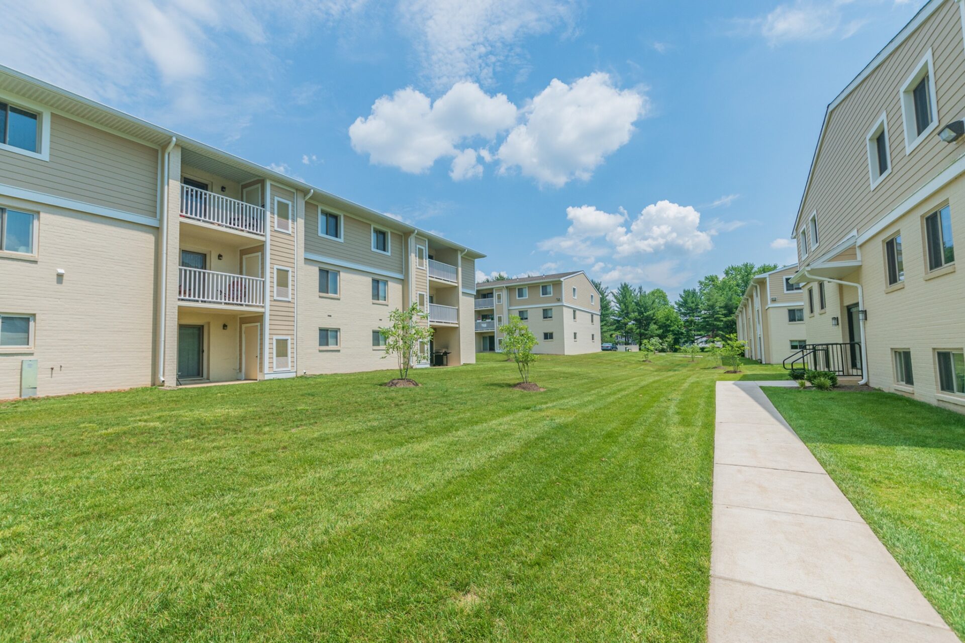Lawn and walkway area of our community at Caln East apartments
