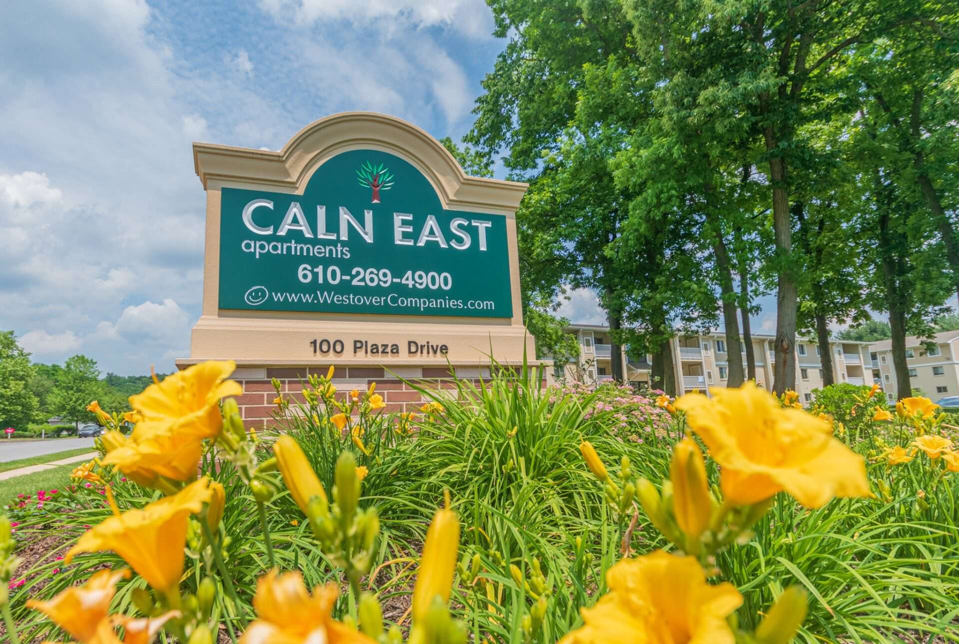 Caln East apartments welcome sign, fitted in a beautiful garden