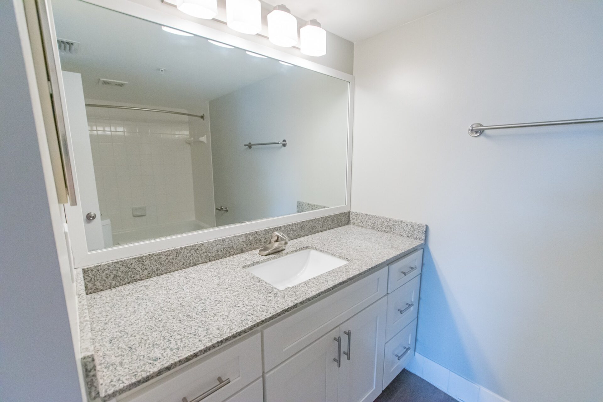Bathroom with large mirrors and lots of countertop space.