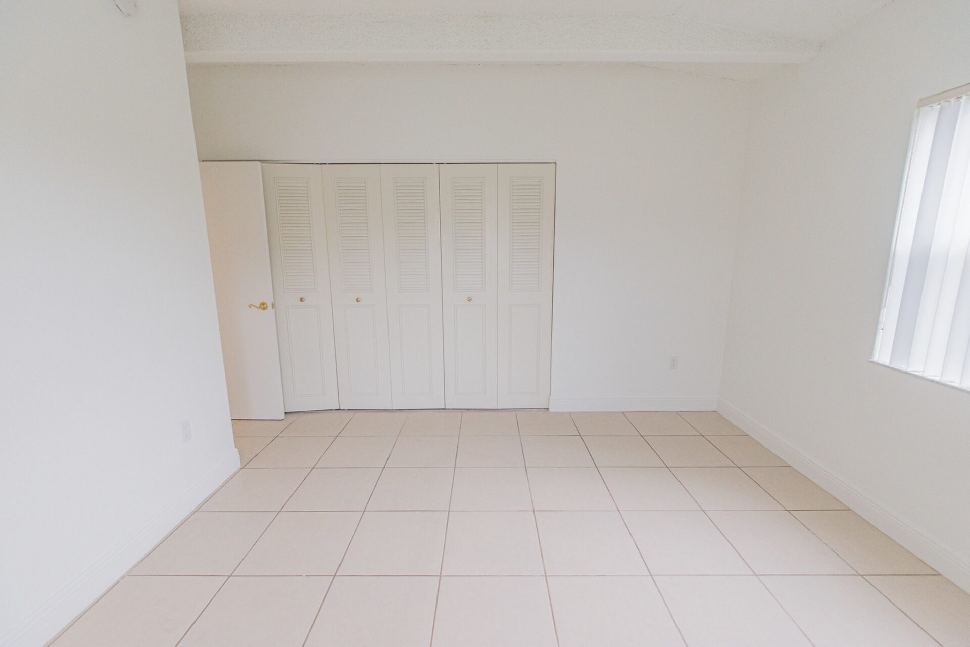 Spacious area with a closet and a window in an apartment at Green Briar West.
