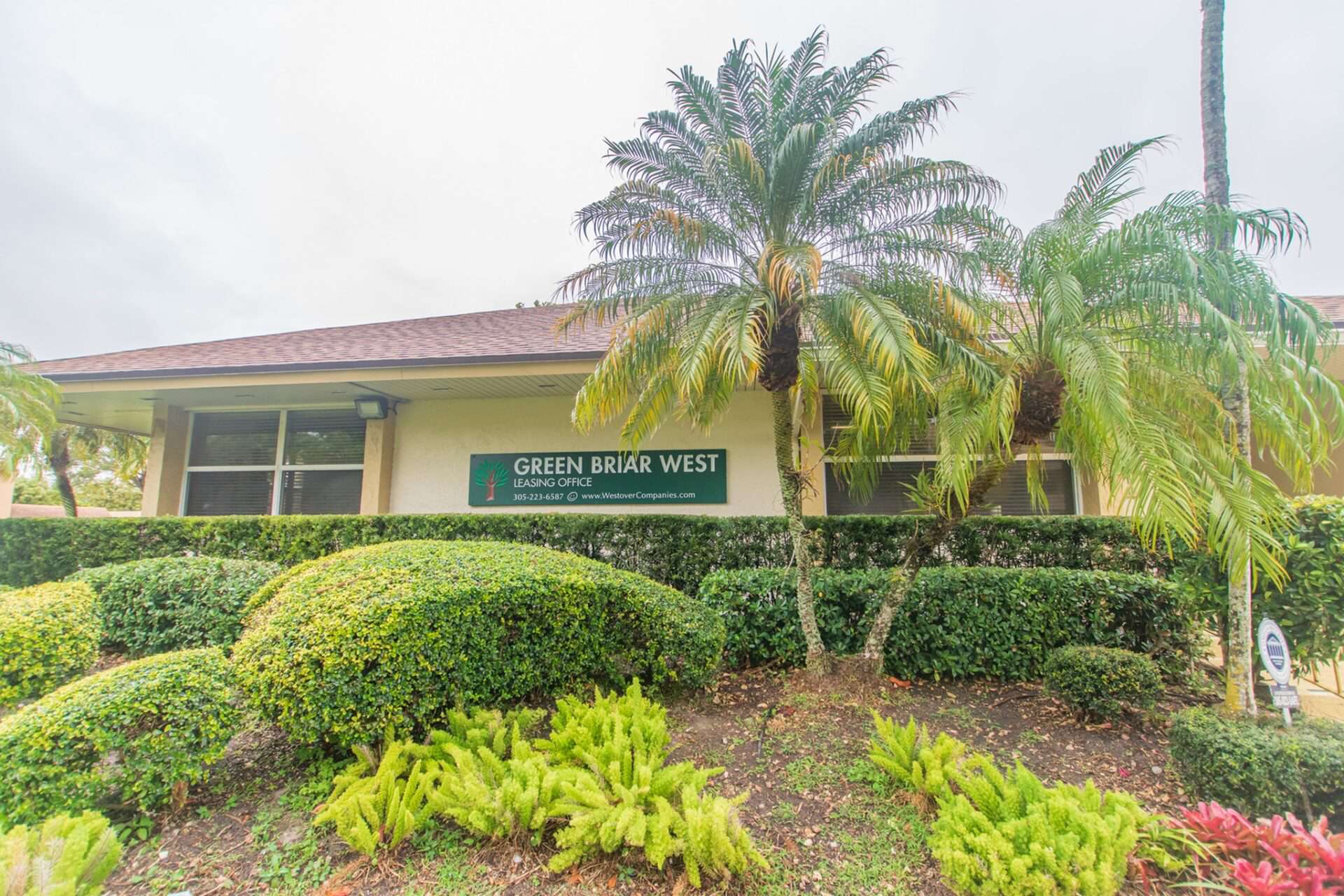 Exterior of the leasing office at Green Briar West apartments.