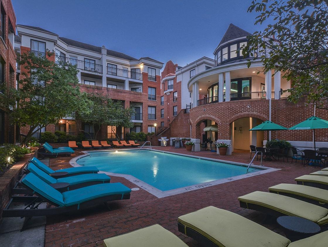 Waterloo Place Apartments exterior with dazzling pool and loungers