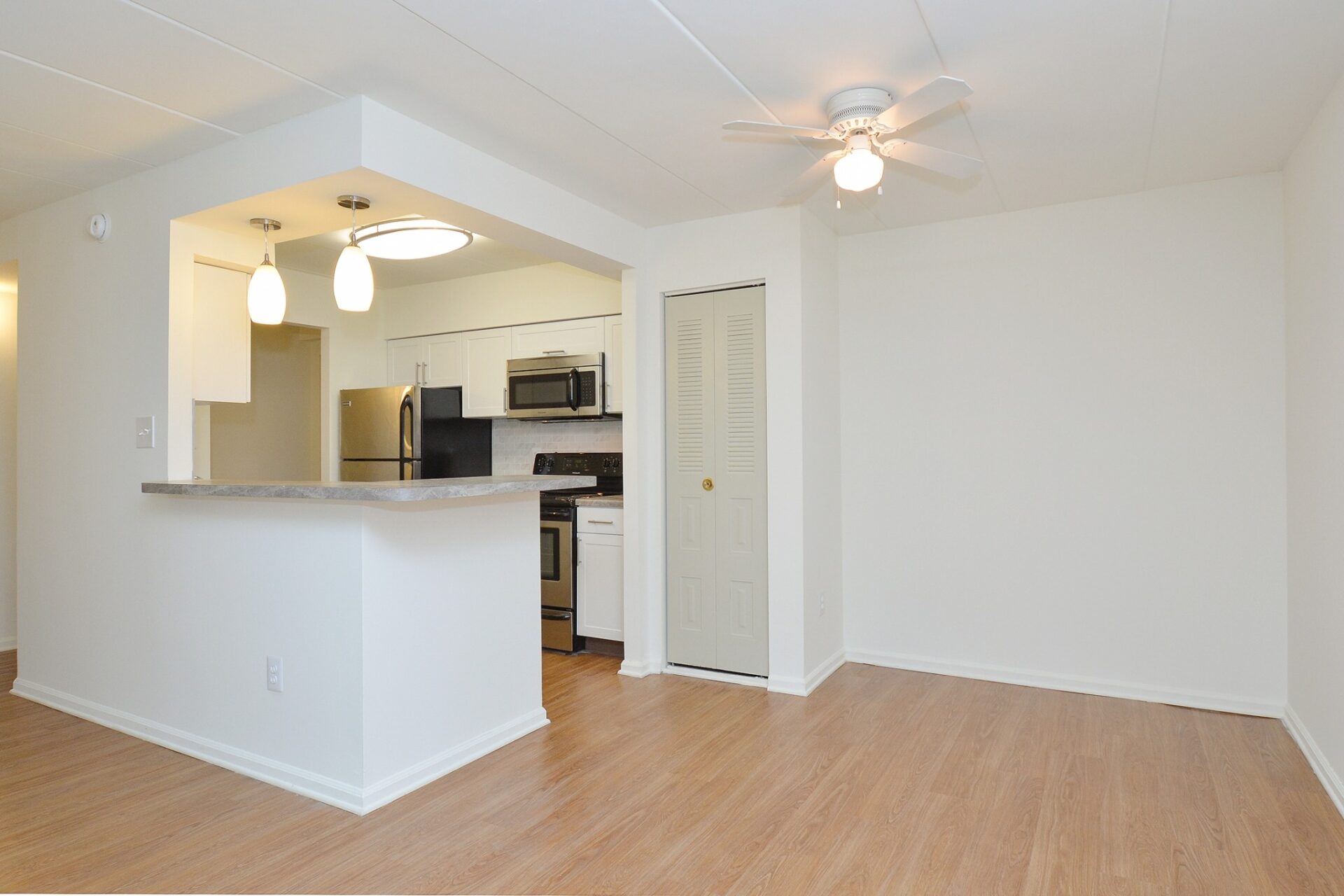 Kitchen and dining area with wood floors at The Lafayette at Valley Forge apartments