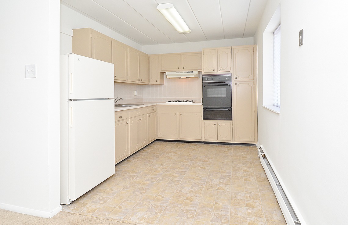 Kitchen area with light beige cabinets and a window at an apartment in East Norriton, PA.