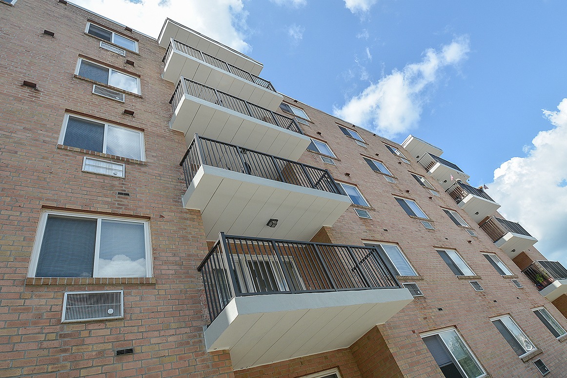 Exterior of an apartment building with balconies.