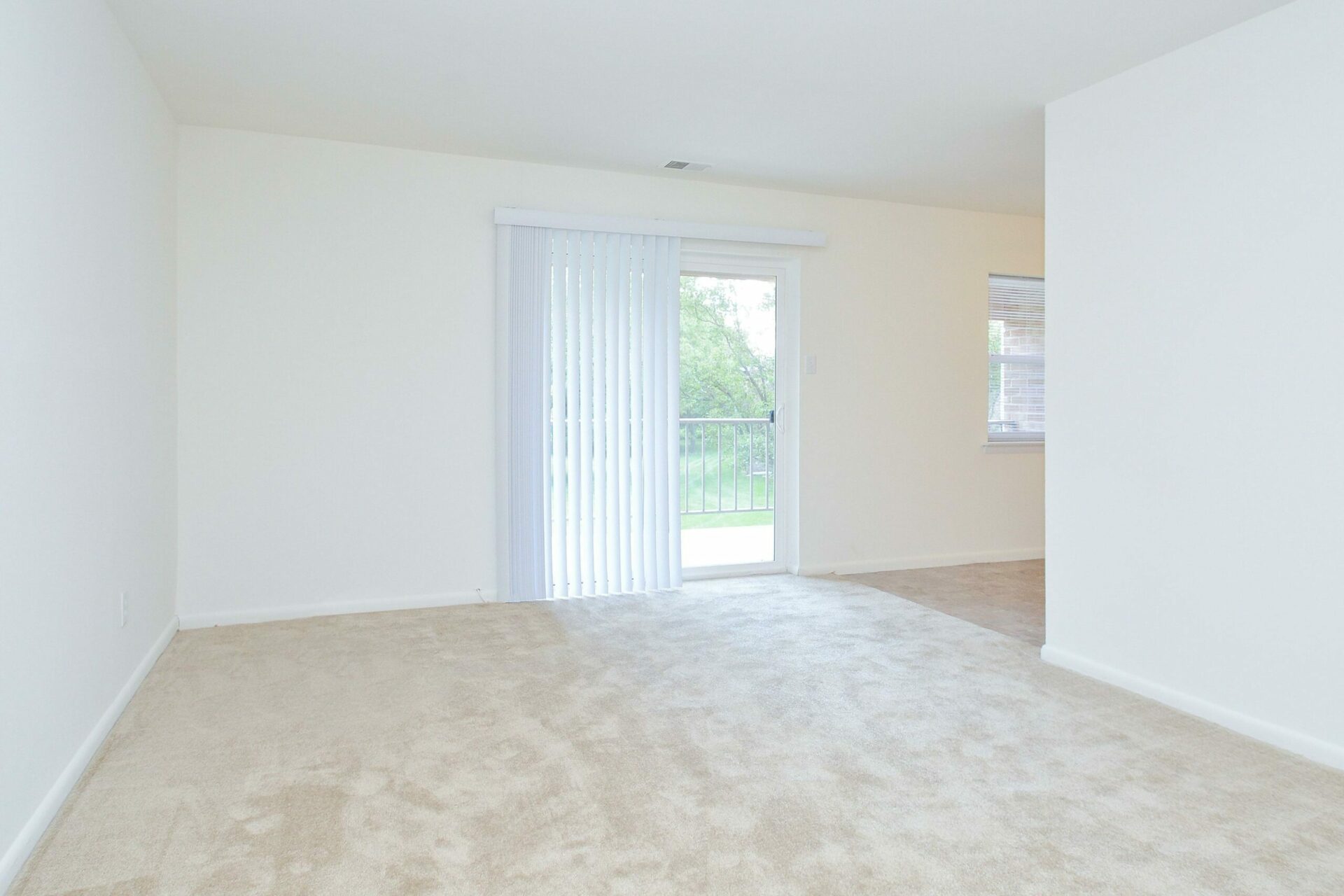 Living area with sliding doors to the balcony at Westover Village