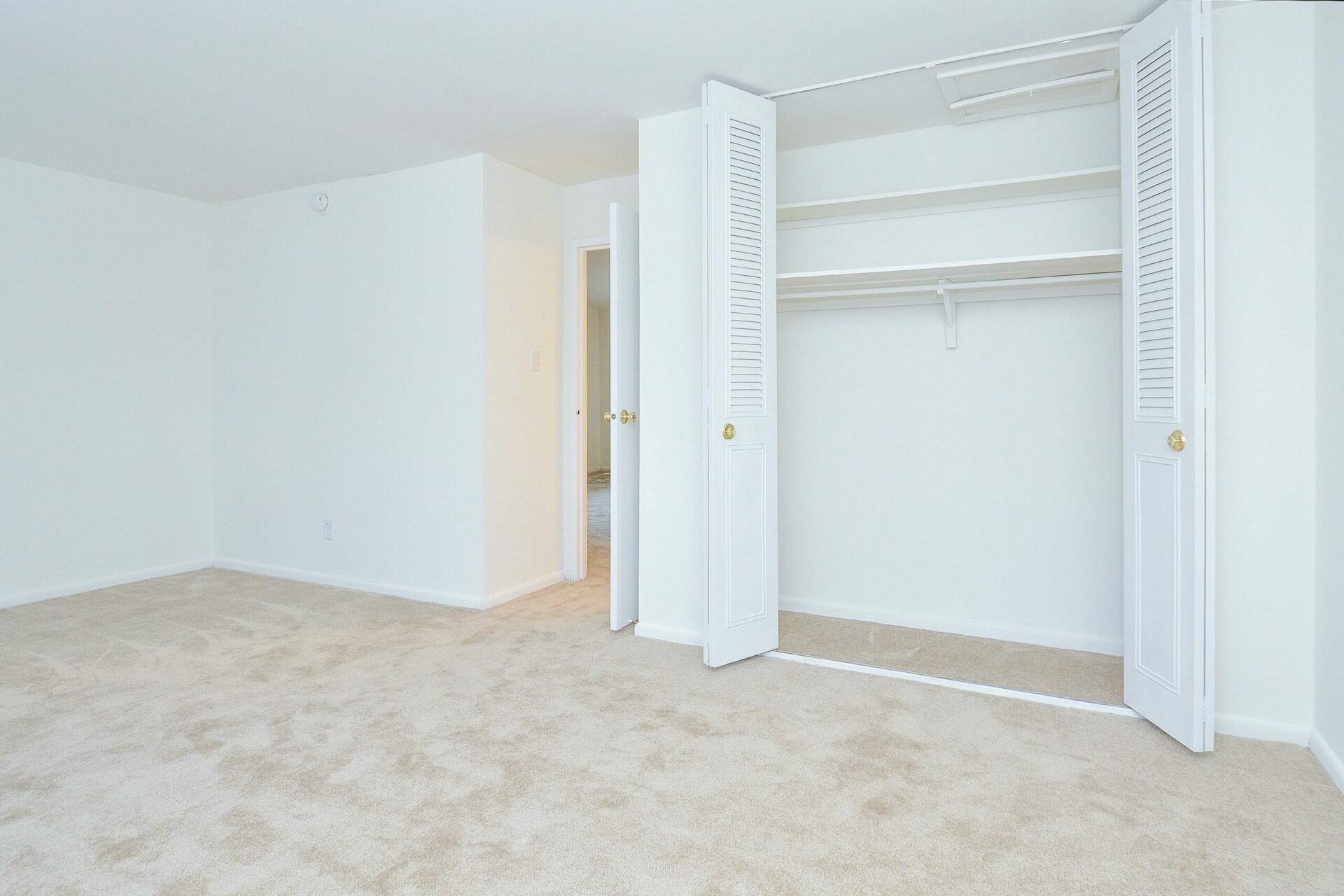 Westover Village carpeted bedroom with double door closet