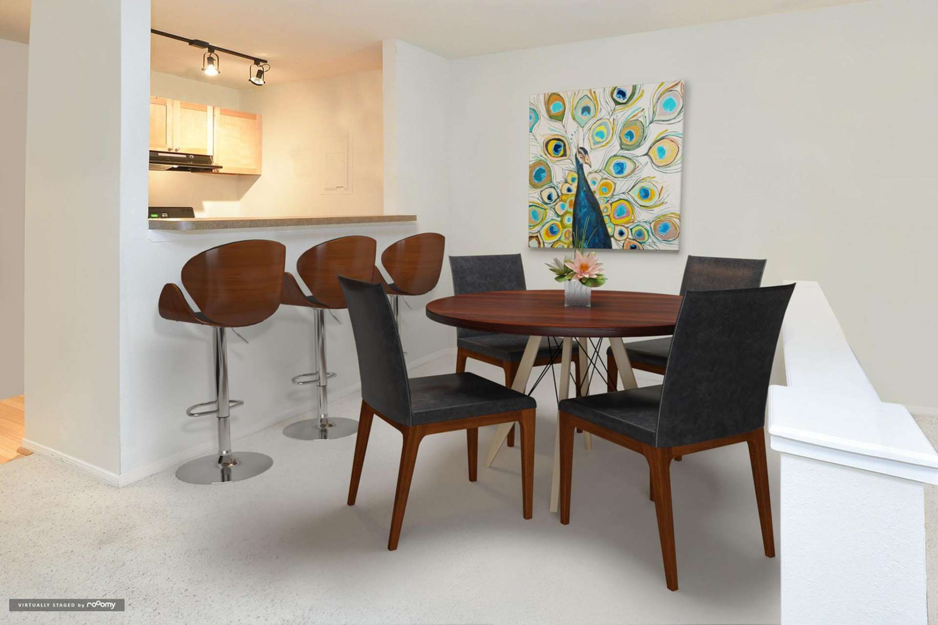 Dining area with table and bar counter in an apartment at Waterloo Place.