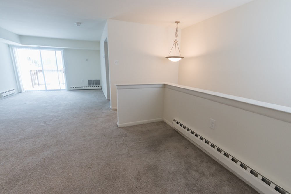 Carpeted upstairs living are at Wyntre Brooke Apartments