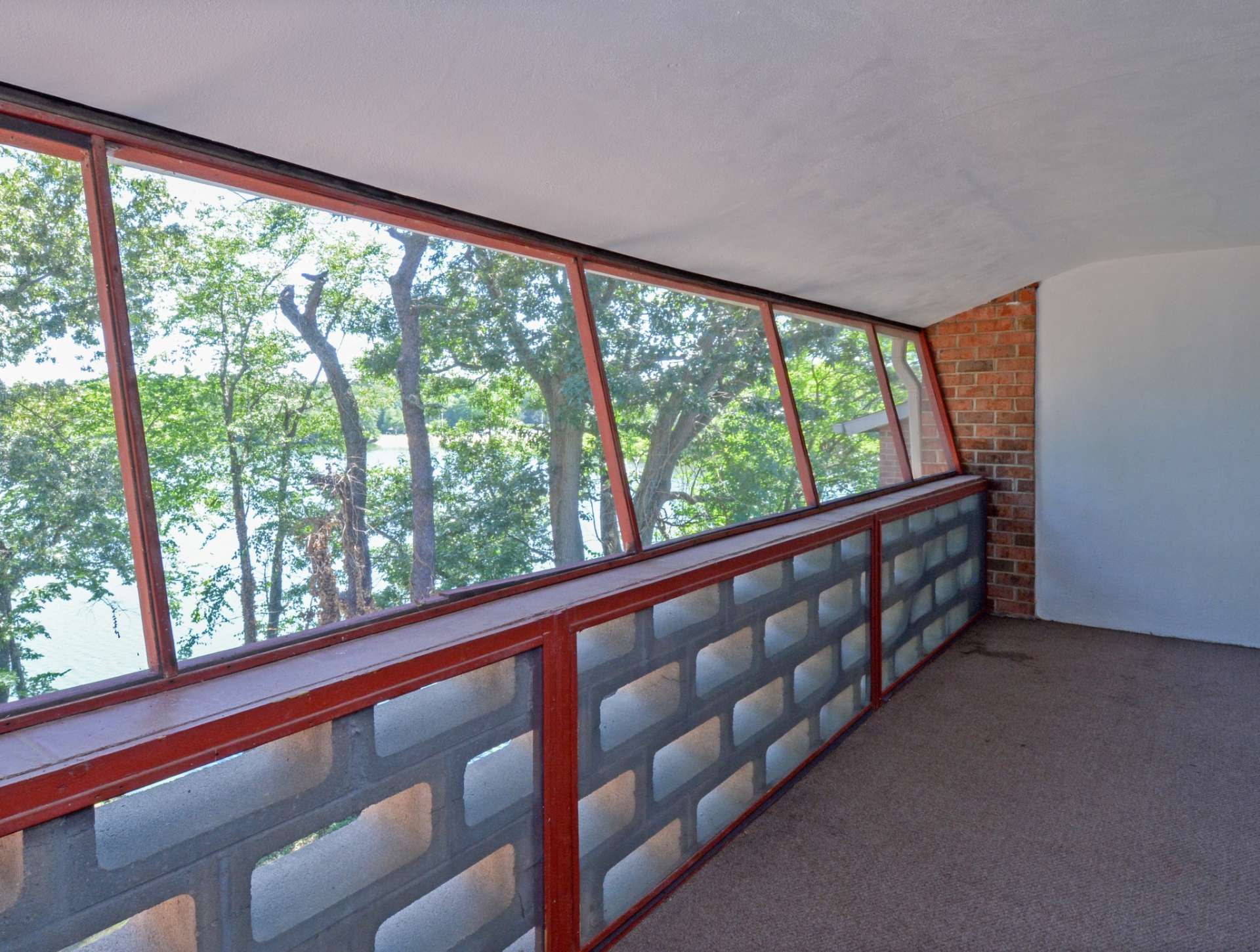 Balcony-style space with views of the lake at Lake Club Apartments.