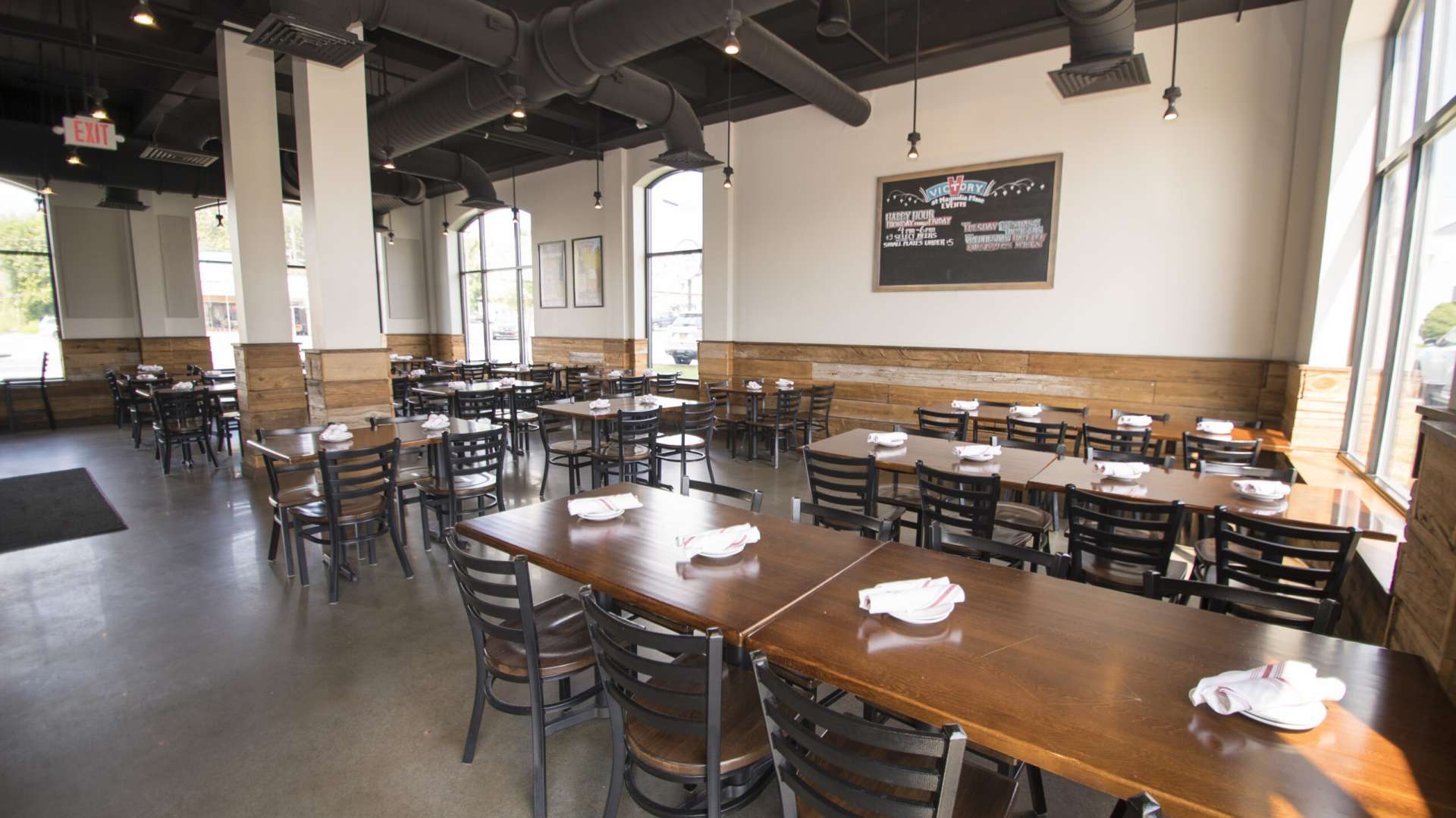 Interior of Victory Brewing Company with numerous dining tables and chairs.