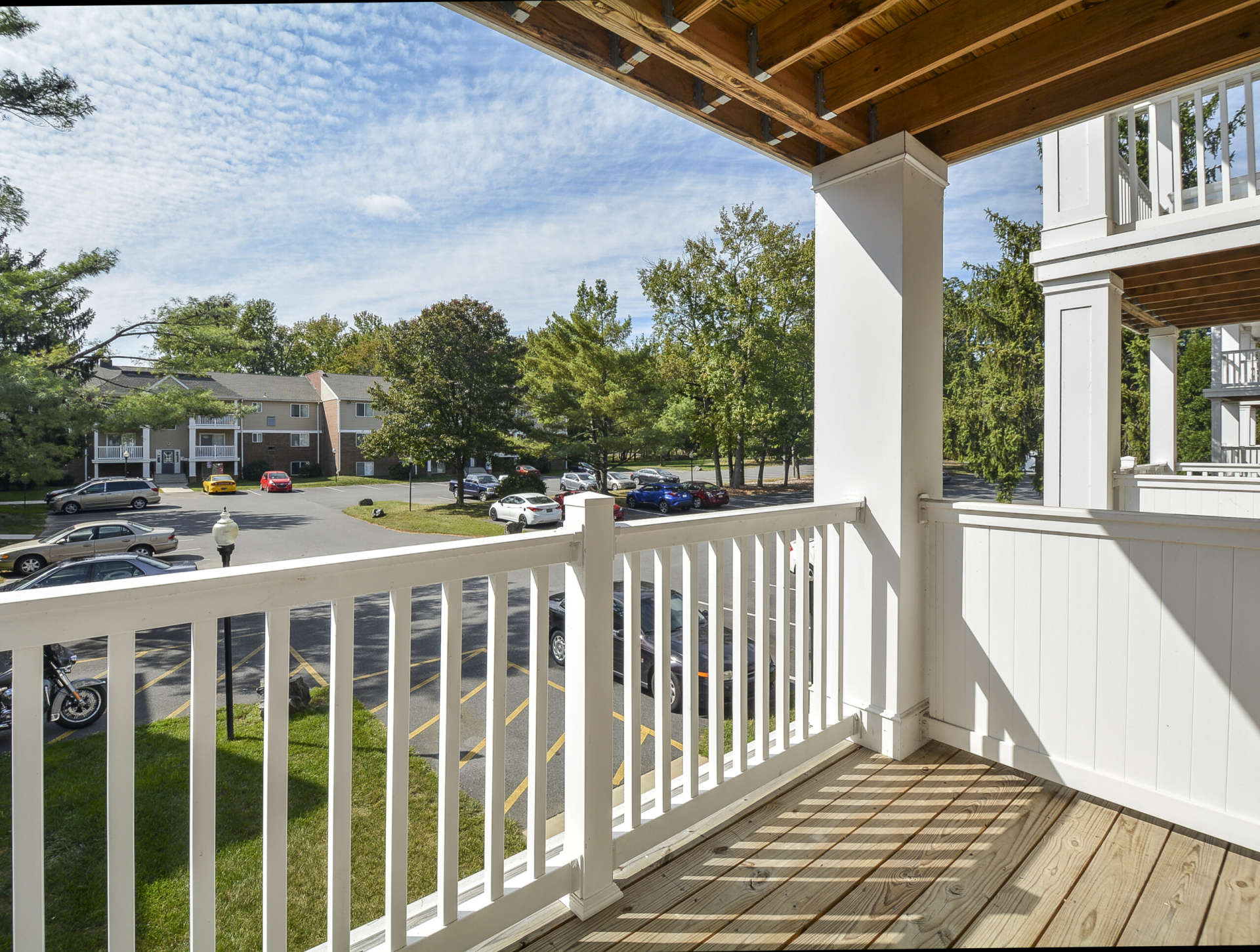 Apartment balcony with a view of the parking lot at Glen Eagle Village.