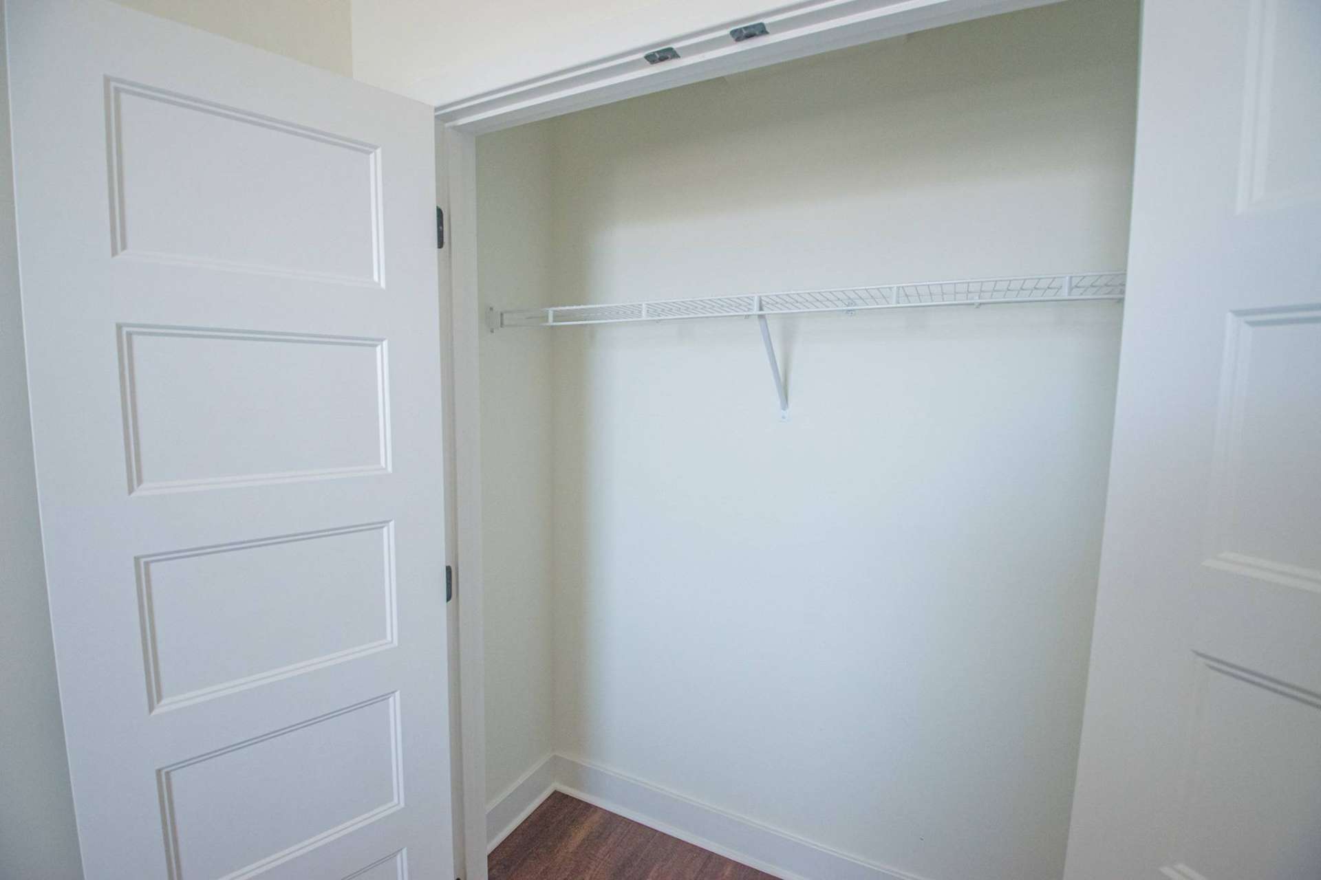 Closet with a shelf in an apartment at Magnolia Place Apartments.