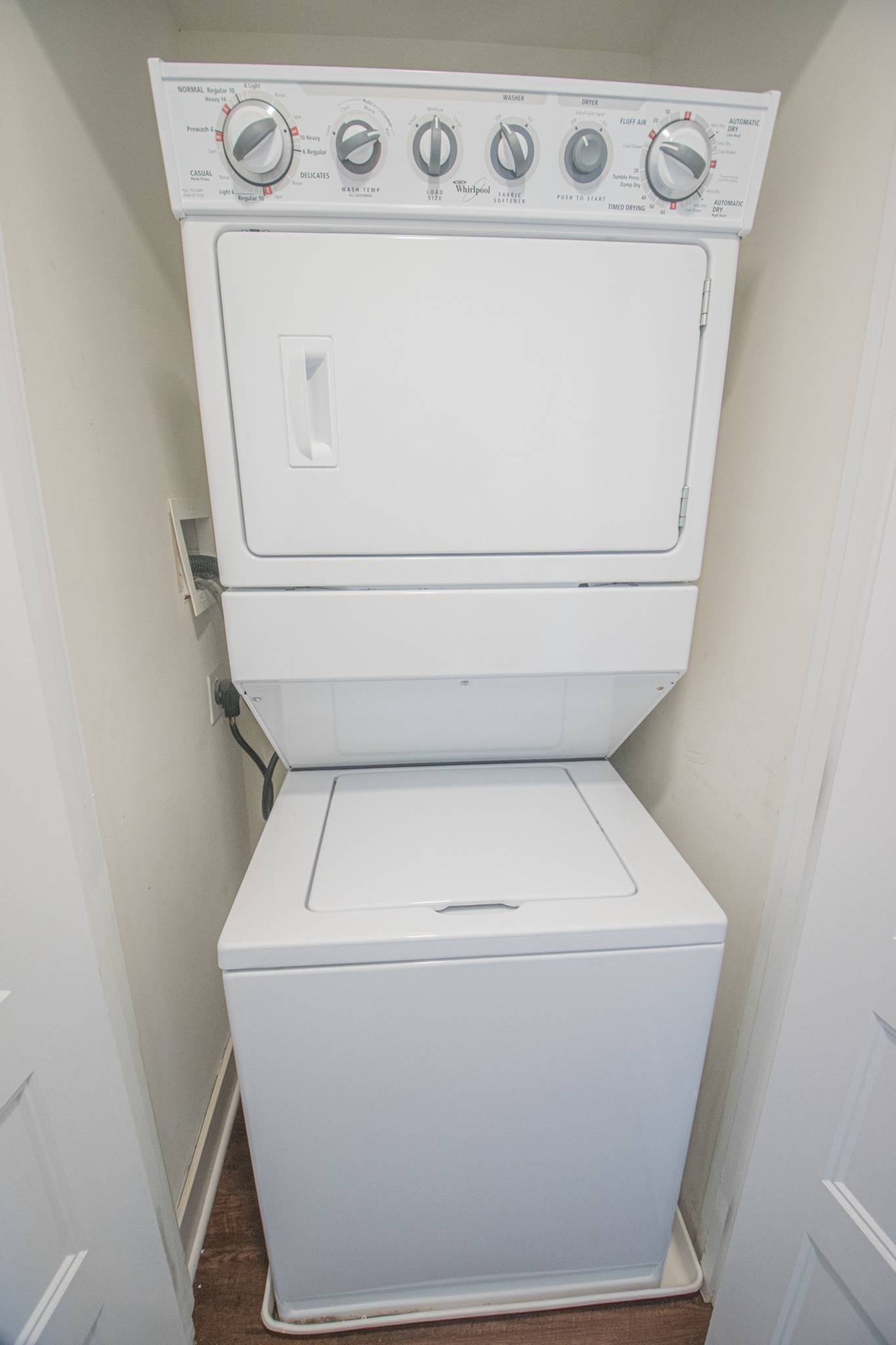 Stackable washer and dryer in an apartment at Magnolia Place Apartments.