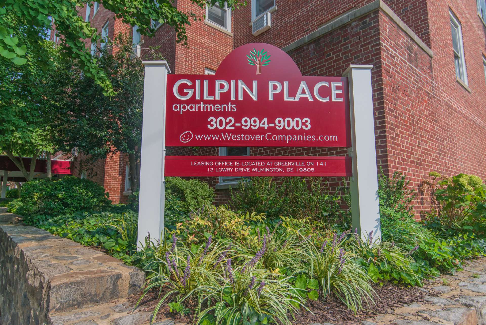 Gilpin Place apartments welcome sign, fitted in a beautiful garden