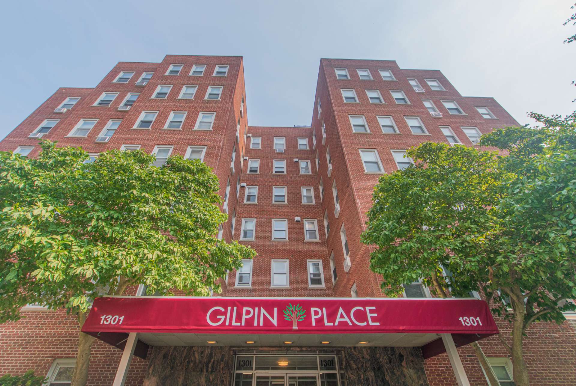 Entrance to the leasing office at Gilpin Place apartments, fitted with a huge awning, and entrance door