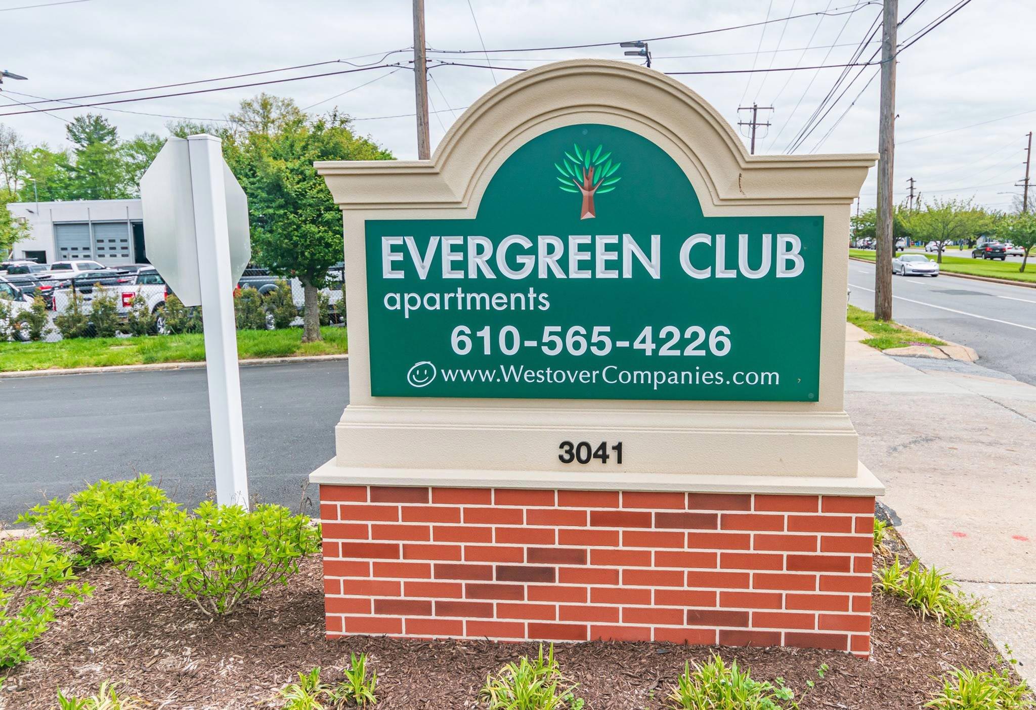 Evergreen Club Apartments entrance sign.