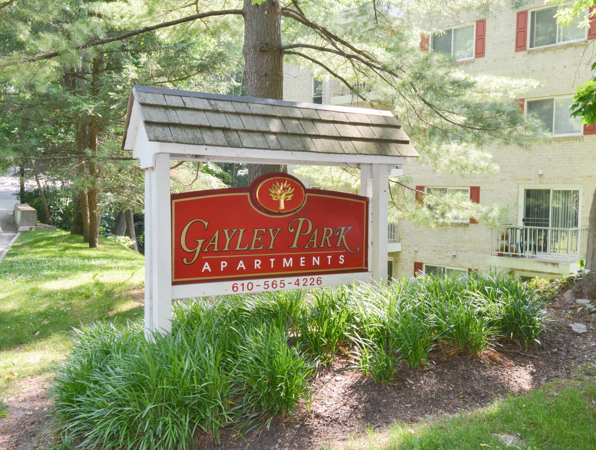 Gayley Park apartments welcome sign, fitted in a beautiful garden
