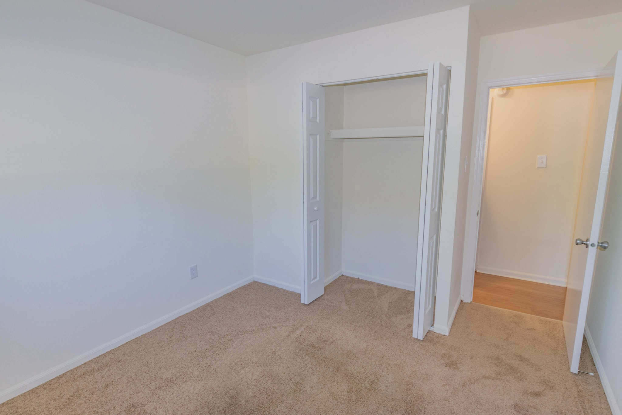 Rosetree Crossing carpeted bedroom with closet