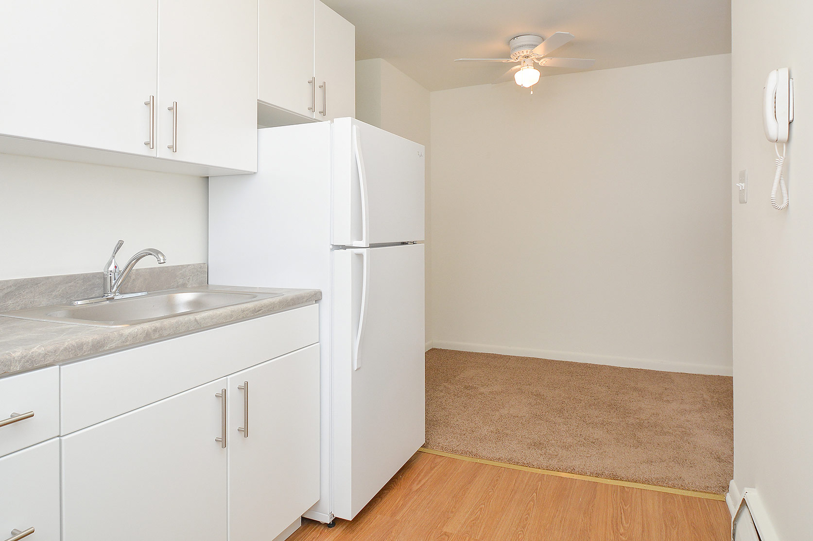Woodview Apartments kitchen with white appliances
