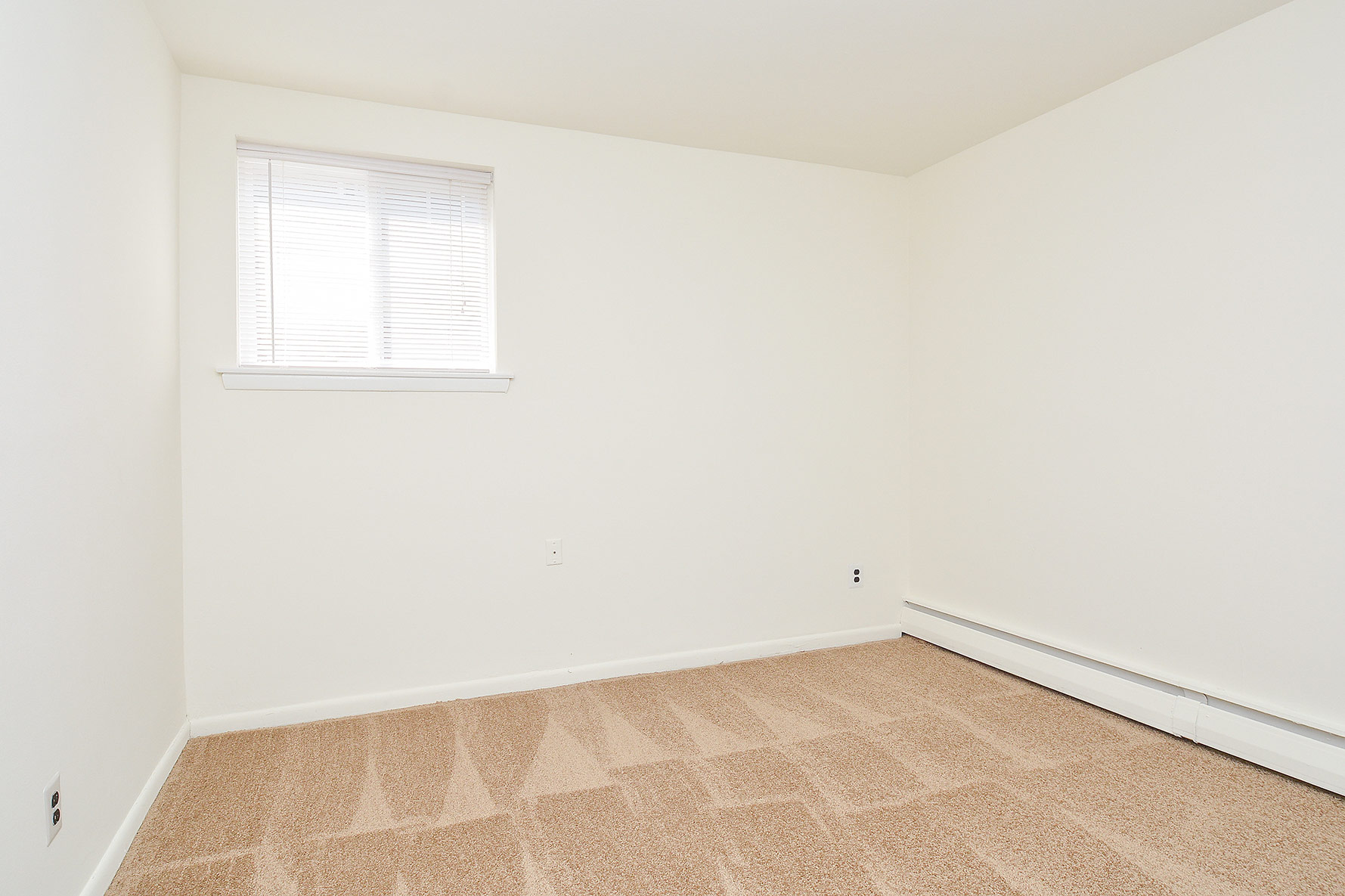 Woodview Apartments carpeted bedroom