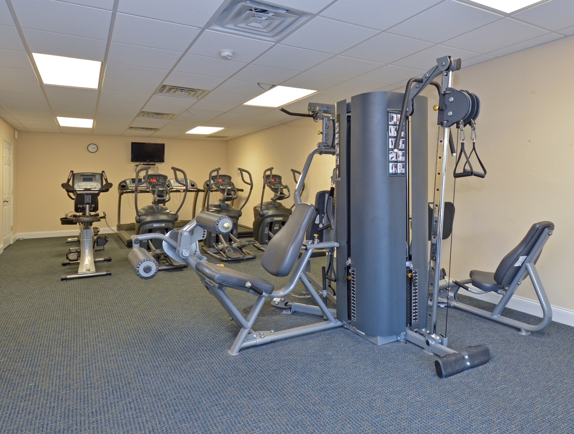 Fitness center area of our community, fitted with fitness equipment, and soft flooring