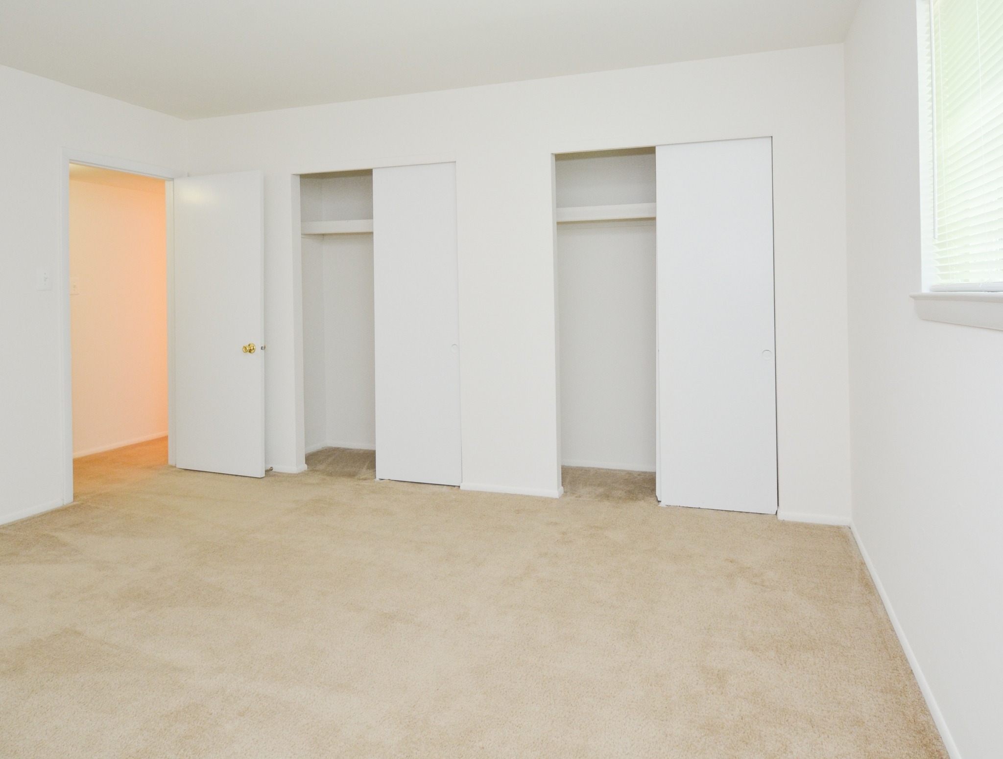 Rolling Glen carpeted bedroom with two closets
