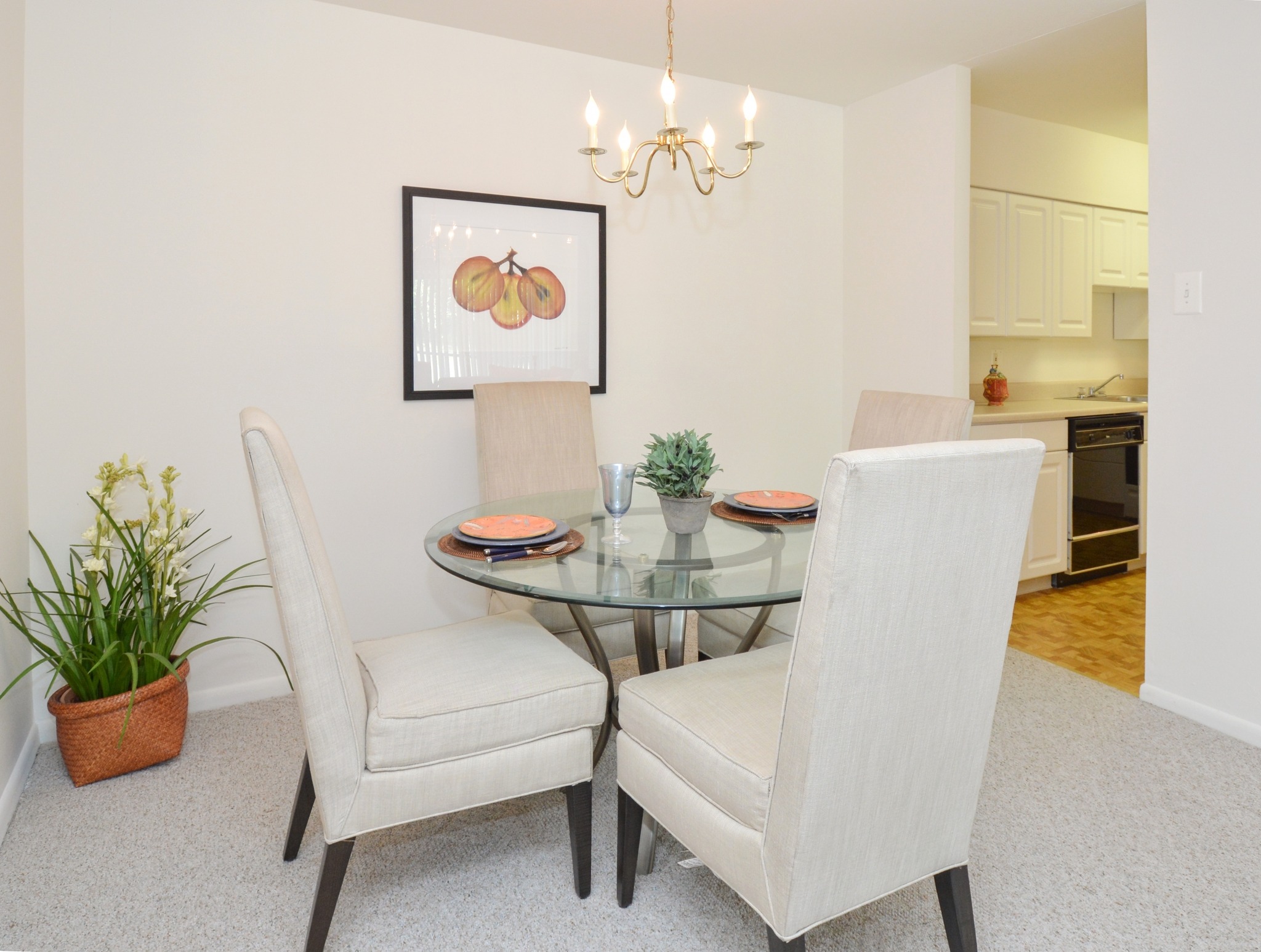 A carpeted dining area off the kitchen at Valley Stream Apartments