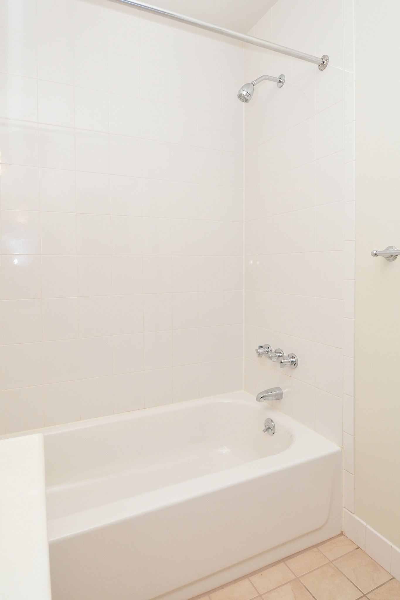 Bathtub in a bathroom of an apartment at Newport Village Apartments.
