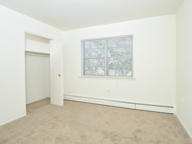 Woodland Plaza Apartments bedroom with a window