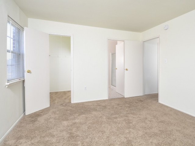 Woodland Plaza Apartments bedroom with a closet