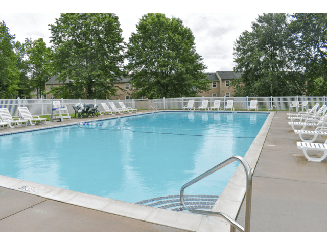 Willow Ridge Village Apartments expansive pool with loungers