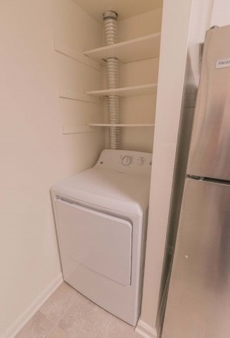 In unit washer & dryer area of an apartment, fitted with a in unit dryer