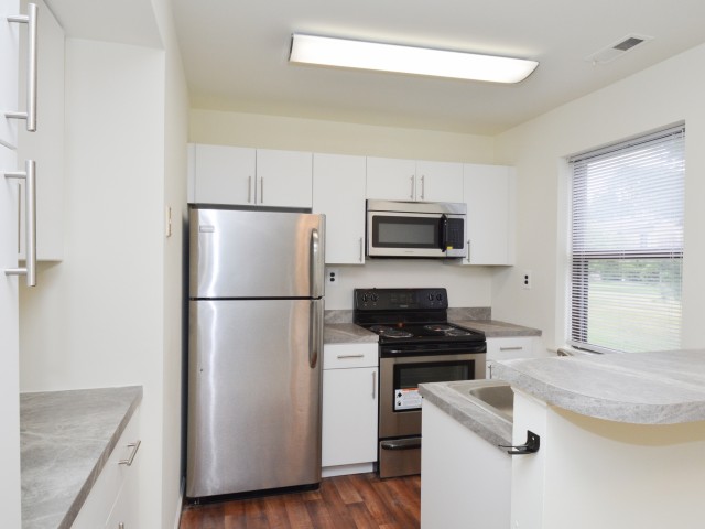 Willow Ridge Village Apartments kitchen with white cabinets and stainless steel appliances