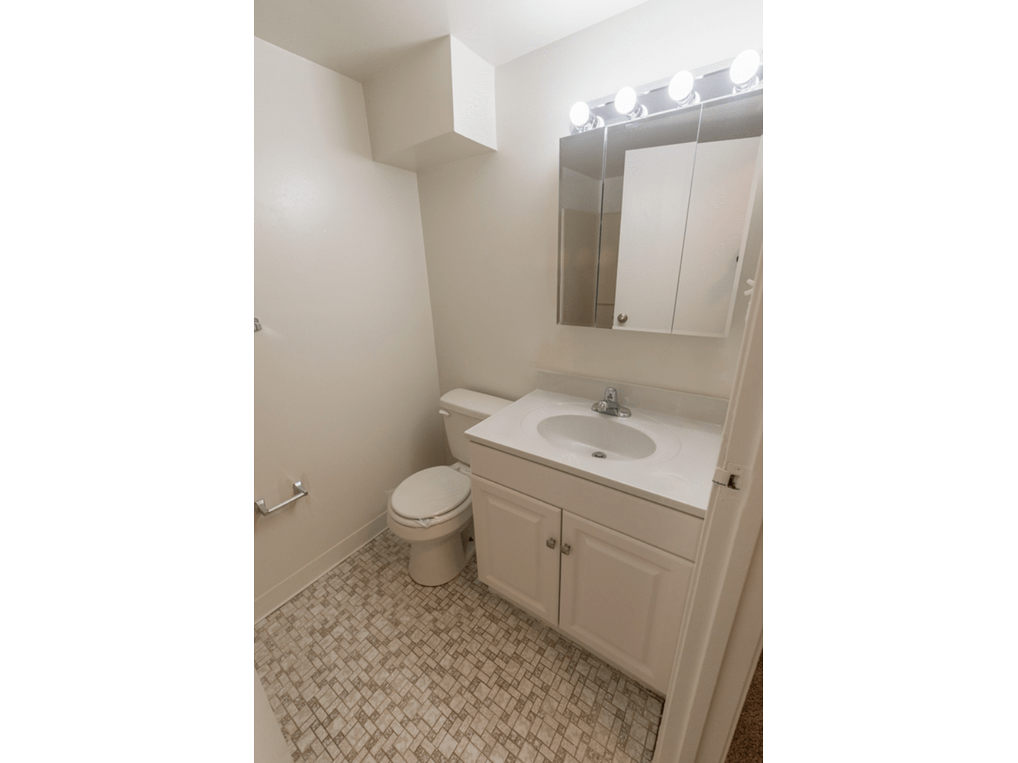 Bathroom at Winslow House apartments with tiled floors