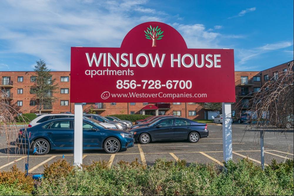 Winslow House Apartments signage in parking lot