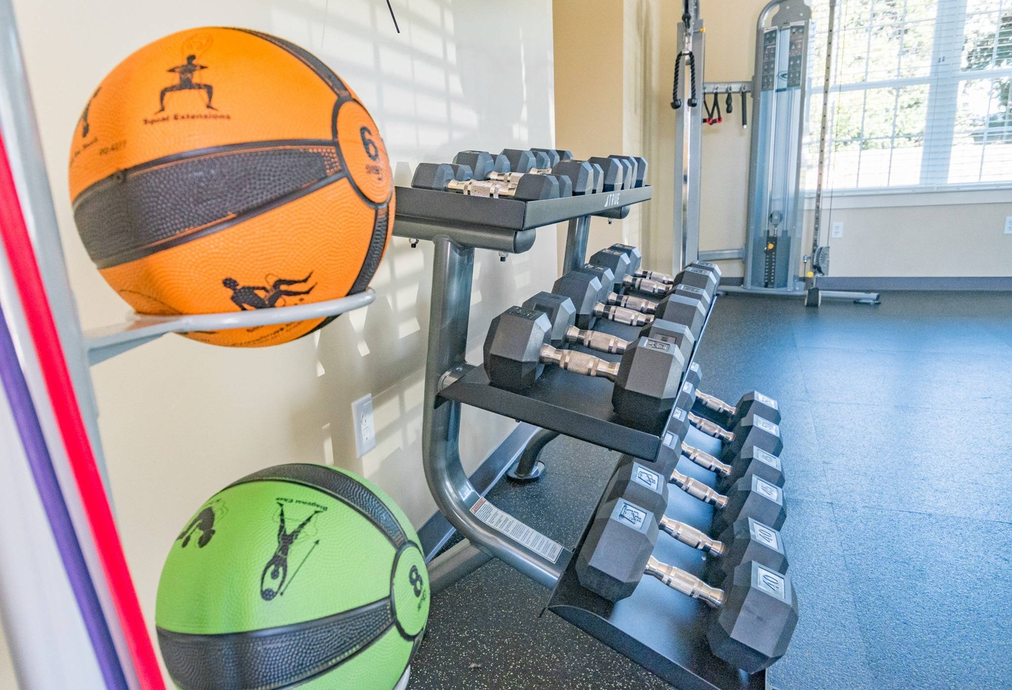 Woodland Plaza Apartments fitness center with exercise equipment