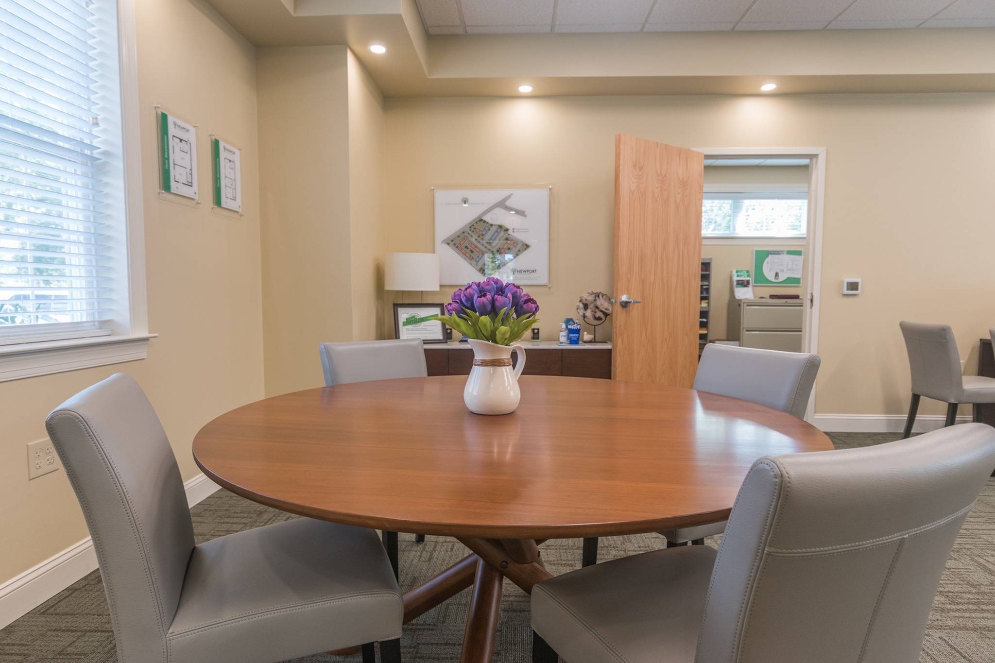 Circular table in the leasing office at Newport Village Apartments.