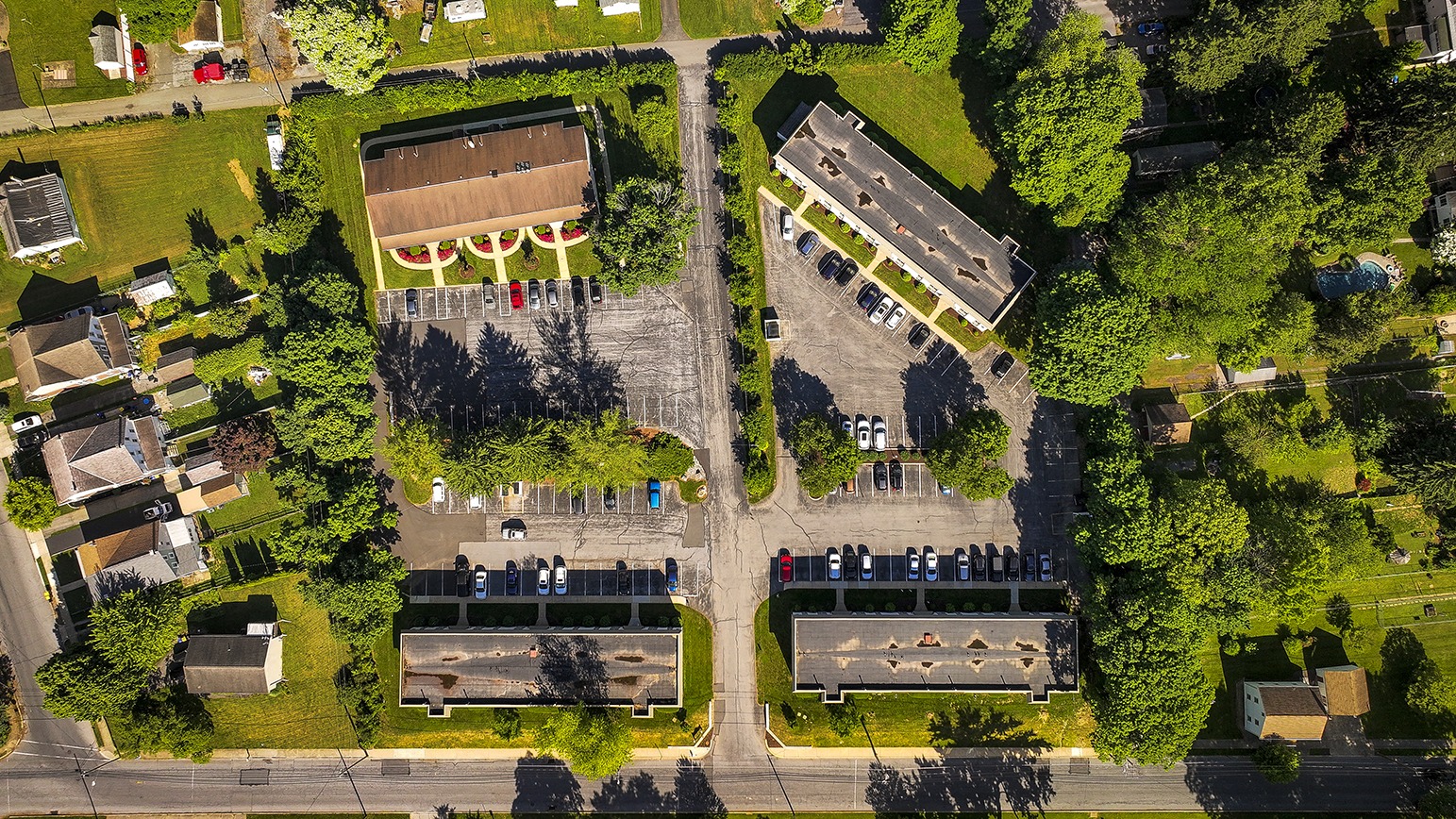 Overhead exterior view of Park Court apartments, lawns and trees